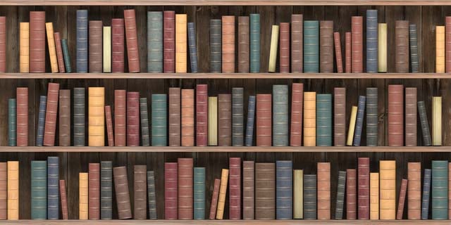 vintage-books-on-old-wooden-shelf-old-library