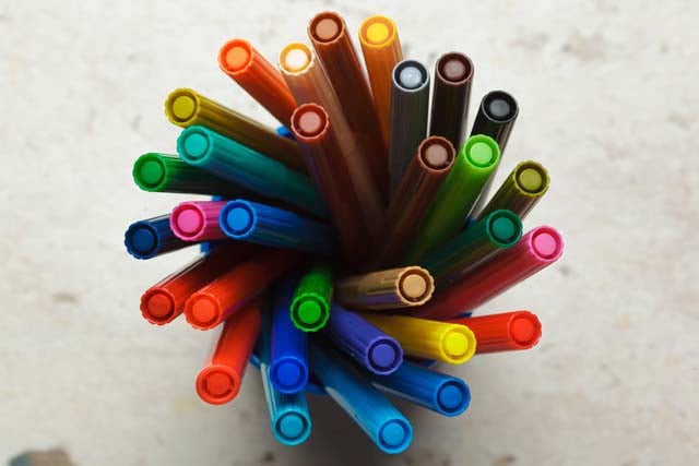set-of-markers-in-a-plastic-cup