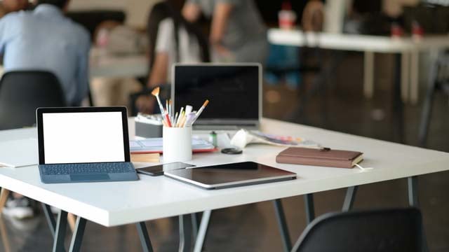 cropped-shot-of-tablet-laptop-and-stationary